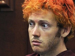 In this July 23, 2012, file photo, James Holmes, who is charged with killing 12 moviegoers and wounding 70 more in a shooting spree in a crowded theatre in 2012, sits in Arapahoe County District Court in Centennial, Colo. The relationship Arlene and Robert Holmes had with their son James had been strained since he was a young boy. After he left for graduate school, their communication was mostly confined to terse emails. Holmes told a psychiatrist years after his gunshots killed 12 people and injured 70 in a crowded Colorado movie theater that he doesn’t like to talk with people, even his mother and father.  (RJ Sangosti/The Denver Post via AP, Pool, File)