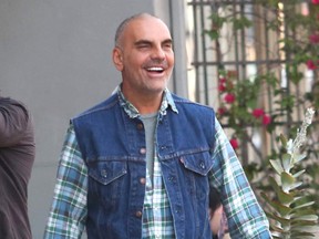 Christian Audigier and his girlfriend Nathalie Sorensen have lunch with Brazilian racing driver Tarso Marques at Bludso's where they ran into business manager Adam Drexler. (WENN.com)