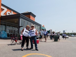Strikers picket outside of the Zehrs in Tecumseh, near Windsor, Ont., on July 2, 2015. THE CANADIAN PRESS/Gene Schilling