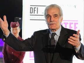 Egyptian veteran actor Omar Sharif poses on the red carpet as he arrives at the opening of the 2011 Doha Tribeca Film Festival in Doha October 25, 2011. REUTERS/Mohammed Dabbous