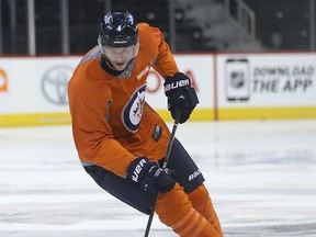 Winnipeg Jets defenceman Paul Postma moves the puck during a light skate in April. Postma signed a new two-year deal with the Jets on Friday. (Brian Donogh/Winnipeg Sun file photo)