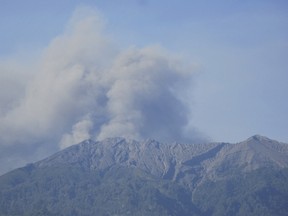 Volcanic ash is emitted from Mount Raung volcano as seen from Bondowoso, East Java, Indonesia, on July 10, 2015, in this photo taken by Antara Foto. (REUTERS/Seno/Antara Foto)