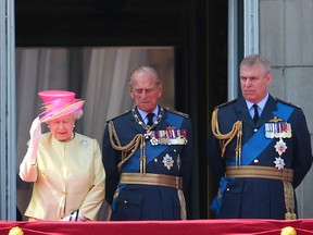Prince Philip stands centre as members of the Royal Family appear on the balcony of Buckingham Palace to watch a fly past of the Battle of Britain Memorial Flight to commemorate the 75th anniversary of the Battle of Britain. (WENN.COM)
