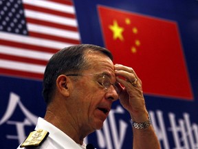 Admiral Mike Mullen, who during 2011 was the chairman of the U.S. Joint Chiefs of Staff, reacts to a question from the audience at the Renmin University in Beijing. Mullen, the top U.S. military officer, began a four-day trip to China in another sign of warming military ties between the two countries after a break in relations following a $6.3 billion U.S. arms deal with Taiwan. REUTERS/David Gray
