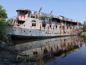 The MS Lord Selkirk II, a cruise ship abandoned in Selkirk, Man., since 1990, will finally be removed from the slough located next to the Red River. The provincial government announced Friday, July 10, 2015 that it will provide $200,000 toward the City of Selkirk's efforts to dismantle the ship. (Brook Jones/Selkirk Journal/Postmedia Network)