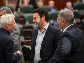 (Left to right) Former Alberta NDP leader Ray Martin, Gil McGowan of the Alberta Federation of Labour and Guy Smith, president of the Alberta Union of Provincial Employees, speak before the Speech From The Throne at the Alberta Legislature in Edmonton, Alta., on Monday June 15, 2015. The Speech From The Throne marks the beginning of the 29th Legislature. Ian Kucerak/Edmonton Sun