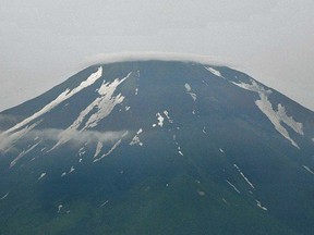 Mount Fuji, the highest mountain in Japan at 3,776 metres is seen from Yamanakako village, Yamanashi prefecture on July 1, 2013. (AFP PHOTO/KAZUHIRO NOGI)