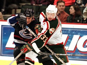 Scott Pellerin (right, as a member of the Minnesota Wild in 2000) has 11 seasons of NHL experience to draw on in his role as the Maple Leafs’ director of player development. He wants players to be pushed beyond their limits. (ERIC MILLER/Reuters files)