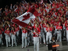 Team Canada enters the Rogers Centre during the opening ceremonies for the Pan Am Games. (MICHAEL PEAKE, Toronto Sun)