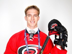 Fifth overall pick Noah Hanifin of the Carolina Hurricanes poses for a portrait during the 2015 NHL Draft at BB&T Center on June 26, 2015 in Sunrise, Florida. (Mike Ehrmann/Getty Images/AFP)