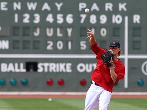 Brock Holt of the Boston Red Sox throws during batting practice before a game against the New York Yankees at Fenway Park on July 10, 2015. (Jim Rogash/Getty Images/AFP)