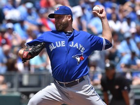 Toronto Blue Jays pitcher Mark Buehrle delivers a pitch against the Kansas City Royals during the first inning at Kauffman Stadium. The veteran starter allowed just five hits over seven innings without issuing a walk en route to his 10th win of the season. (Peter G. Aiken-USA TODAY Sports)