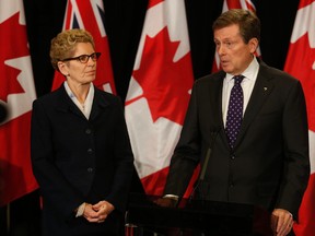 Premier Kathleen Wynne meets with Mayor John Tory on his first day in office on Dec. 1, 2014. (Jack Boland/Toronto Sun)