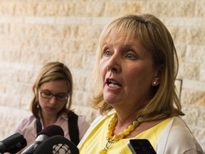 Councillor Diane Deans speaks with members of the media following the last council meeting before their summer break on Wednesday July 8, 2015. 
Errol McGihon/Ottawa Sun