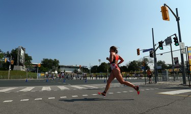 Canadian Paula Findlay runs along lakeshore during the run portion of the Women's Triathlon during the 2015 Pan Am Games in Toronto on Saturday July 11, 2015. Dave Abel/Toronto Sun/Postmedia Network