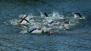 Competitors complete the the swim during the Women's Triathlon during the 2015 Pan Am Games in Toronto on Saturday July 11, 2015. Dave Abel/Toronto Sun/Postmedia Network