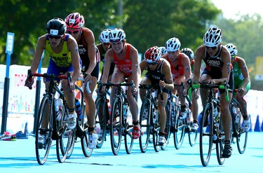 Canadian Ellen Pennock on the bike during the Women's Triathlon during the 2015 Pan Am Games in Toronto on Saturday July 11, 2015. Dave Abel/Toronto Sun/Postmedia Network