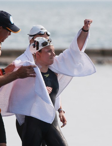 American Eva Fabian celebrates her victory as she won the 10K Women's Open Water Swim near Ontario Place on Lake Ontario on Saturday July 11, 2015. Stan Behal/Toronto Sun/Postmedia Network
