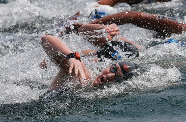 Canadian long distance swimmer Samantha Harding (in foreground) came in 8th as American Eva Fabian won the 10K Women's Open Water Swim near Ontario Place on Lake Ontario on Saturday July 11, 2015. Stan Behal/Toronto Sun/Postmedia Network