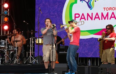 A band plays on the main stage at Pan Am Park at Exhibition Centre on Day One of the Games on Saturday July 11, 2015. Jack Boland/Toronto Sun/Postmedia Network