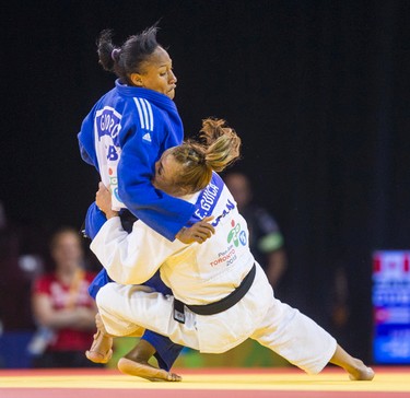 Ecaterina Guica (Canada, in white outfit) and Gretter Romero (Cuba) in the Judo Women's Under 52kg Quarter Final Contest 6 during Pan Am Games  afternoon Judo preliminary competition at the Mississauga Sports Centre in Mississauga, Ont. on Saturday July 11, 2015. Guica won the round.  Ernest Doroszuk/Toronto Sun/Postmedia Network