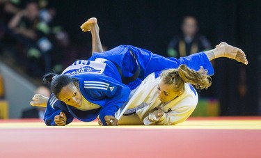 Ecaterina Guica (Canada, in white outfit) and Gretter Romero (Cuba) in the Judo Women's Under 52kg Quarter Final Contest 6 during Pan Am Games  afternoon Judo preliminary competition at the Mississauga Sports Centre in Mississauga, Ont. on Saturday July 11, 2015. Guica won the round.  Ernest Doroszuk/Toronto Sun/Postmedia Network