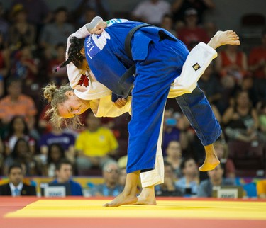 Erin Morgan (Canada, white outfit) and Isandrina Sanchez (Dominican Republic) during the Judo 1/8th final in the under 48kg category Contest 1 during the Pan Am Games at the Mississauga Sports Centre in Mississauga, Ont. on Saturday July 11, 2015.  Sanchez won the round. Ernest Doroszuk/Toronto Sun/Postmedia Network