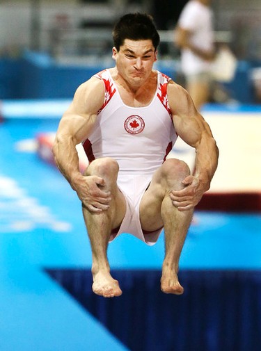 Canada's Kevin LYTWYN spins over the vault  during the Mens Gymnastics Artistic Competition on Saturday July 11, 2015. Veronica Henri/Toronto Sun/Postmedia Network