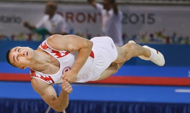 Scott MORGAN of Canada performs a floor routine in the Mens Gymnastics Artistic Competition on Saturday July 11, 2015. Veronica Henri/Toronto Sun/Postmedia Network
