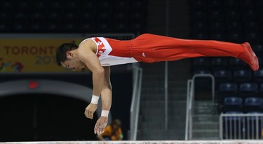 Canada's Ken IKEDA on the parallel bars during the Mens Gymnastics Artistic Competition on Saturday July 11, 2015. Veronica Henri/Toronto Sun/Postmedia Network