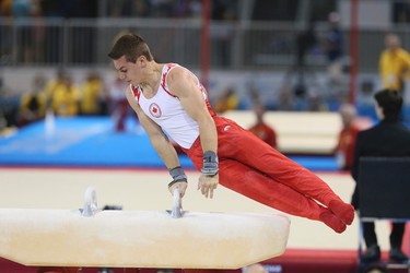 Canada's Rene COURNOYER on the pommel horse during the Mens Gymnastics Artistic Competition on Saturday July 11, 2015. Veronica Henri/Toronto Sun/Postmedia Network