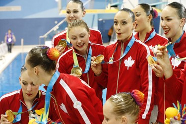 Canada celebrates their gold medal win in the team synchronized swimming event at the Pan Am Aquatic Centre on Saturday July 11, 2015. Michael Peake/Toronto Sun/Postmedia Network