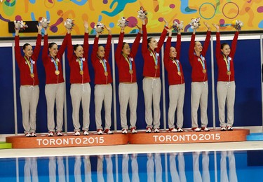 Canada celebrates their gold medal win in the team synchronized swimming event at the Pan Am Aquatic Centre on Saturday July 11, 2015. Michael Peake/Toronto Sun/Postmedia Network