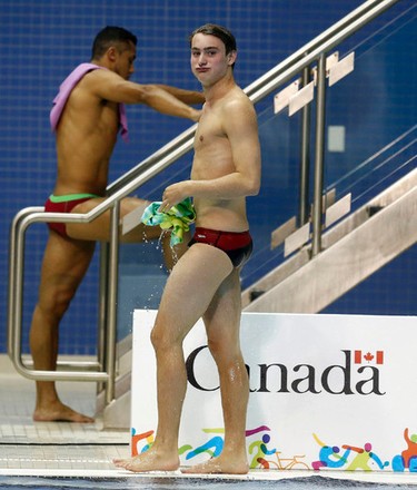 Canadian diver Philippe Gagne reacts to a bad dive but won a bronze medal in the 3 metre springboard the at the Pan Am Aquatic Centre in Toronto on Saturday July 11, 2015. Michael Peake/Toronto Sun/Postmedia Network