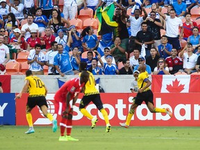 Jamaica midfielder Rudolph Austin (17) celebrates after scoring a goal in stoppage time against Canada during CONCACAF Gold Cup group play at BBVA Compass Stadium. Jamaica defeated Canada 1-0. (Troy Taormina-USA TODAY Sports)
