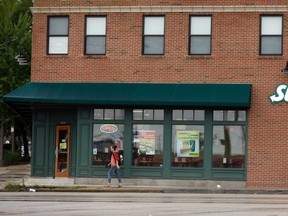 People walk past a Subway restaurant, in St. Louis, in this July 7, 2015 file photo. A man has been arrested for allegedly abandoning his three-year-old daughter at a Subway restaurant in Harlem, N.Y. (AP Photo/Jeff Roberson, File)