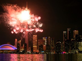 Toronto skyline lights up in fireworks during the opening ceremonies of the 2015 Pan Am Games in Toronto on Friday, July 10, 2015. (Dave Abel/Toronto Sun)