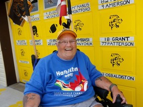Tiger Cats fan Robin MacPherson will allow parking on her front lawn for people attending Pan Am Games events at Tim Hortons Field. (Michael Peake/Toronto Sun)