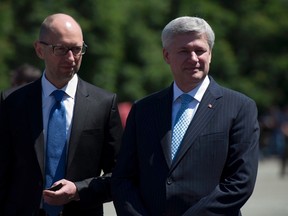 Prime Minister Stephen Harper and Ukraine Prime Minister Arseniy Yatsenyuk visit the Academic Institute of the National Academy of Internal Affairs of Ukraine for Training of Specialists for Public Safety, Psychological Service and National Guard of Ukraine Units in Kyiv, Ukraine, on June 6, 2015. Yatsenyuk will be in Ottawa this week for talks with the Harper government. (THE CANADIAN PRESS/Adrian Wyld)