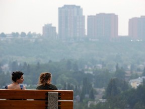 A smoky haze hangs over downtown Edmonton, Alta., on Friday July 10, 2015 seen from 98 Avenue. Forest fires in Saskatchewan and winds have brought smoke to the skies of the Capital Region. PHOTO BY IAN KUCERAK/Edmonton Sun/Postmedia Network
