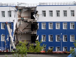 A military barrack with a collapsed ceiling is seen at a base in Omsk, Russia, Monday, July 13, 2015. (AP Photo/Dmitry Feoktistov)