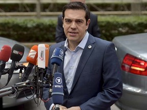 Greece's Prime Minister Alexis Tsipras talks to the media as he arrives at a euro zone leaders summit in Brussels, Belgium, July 12, 2015. REUTERS/Eric Vidal