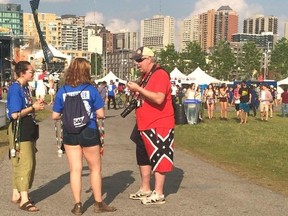 American concertgoer Robert Rusaw was pictured wearing a pair of Confederate flag shorts at Bluesfest last week, and when the image was posted on social media it immediately sparked a debate. (Amanda Lowe via Twitter)