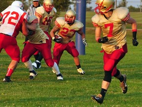 Sarnia Imperials running back Robert Bonanni, named his team's most valuable player, carries the ball in front of quarterback Pat Wright while teammate Brad Churchill runs ahead and prepares to block. The Imperials lost 18-17 on the road to the Hamilton Steel City Patriots. (Cathie Bell photo)