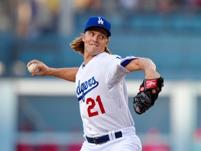 Dodgers' Zack Greinke pitches during first inning MLB action against the Phillies in Los Angeles on Thursday, July 9, 2015. (Mark J. Terrill/AP Photo)