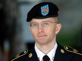 In this  June 5, 2013, file photo Army Pvt. Chelsea Manning, then-Army Pfc. Bradley Manning, is escorted out of a courthouse in Fort Meade, Md., after the third day of his court martial.  The Associated Press has learned that Pentagon leaders are finalizing plans aimed at lifting the ban on transgender individuals serving in the military. Senior U.S. officials say an announcement is expected this week. They say the military would have six months to determine the impact and work out details, with the presumption that they would end one of the last gender- or sexuality-based barriers to military service. AP Photo/Patrick Semansky, File