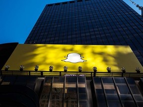 A billboard displays the logo of Snapchat above Times Square in New York City, March 12, 2015. REUTERS/Lucas Jackson