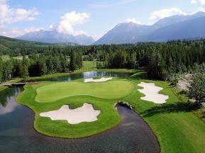 The fourth hole on the Mt. Kidd course at Kananaskis Country Golf Course. Course designer Robert Trent Jones, Senior was one of the first in the world to incorporate an island setting and white sand bunkers.