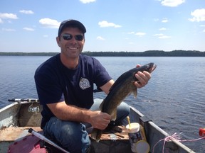 Local Bait2Go inventor JR Paquette shows a typical walleye caught in a secret lake a 50-minute float plane flight from Sudbury last week.