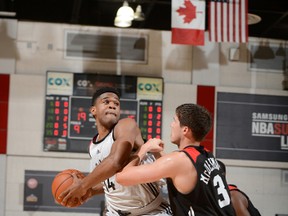 Raptors’ Ronald Roberts (left) handles the ball against the Bulls’ Doug McDermott during Summer League play in Las Vegas. Roberts is a tenacious defender, something the Raps need. (AFP)